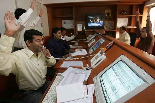 A heavy buying day for operators and retail investors as the Sensex crossed the 9000-mark after touching 9005.63, an intra-day historic high, and ending at a new closing peak of 8994.94 points at the Bombay Stock Exchange on the day Patel resigned. (Manoj Patil/Hindustan Times via Getty Images)