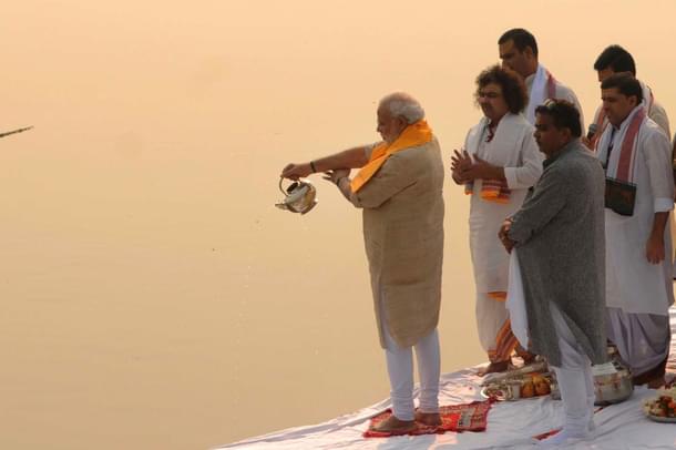 Prime Minister Narendra Modi performing Ganga aarti pooja after cleaning Assi ghat on 8 November 2014 in Varanasi, India. (Ashok Dutta/Hindustan Times via Getty Images) 