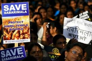 Members of Ayyappa Dharma Samrakshana Samithi hold placards during a protest against the Supreme Court verdict on the entry of women of all ages into the Sabarimala Lord Ayyappa Temple, at Parliament Street, on October 14, 2018 in New Delhi, India. (Photo by Amal KS/Hindustan Times via Getty Images) 