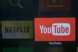 Youtube and Netflix app logos on a television screen. (Photo by Chris McGrath/Getty Images)