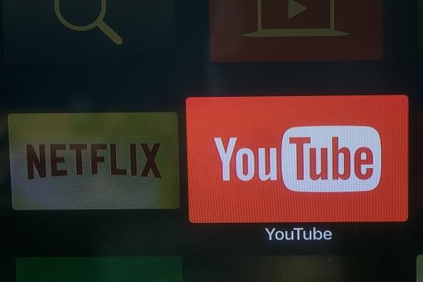 Youtube and Netflix app logos on a television screen. (Photo by Chris McGrath/Getty Images)