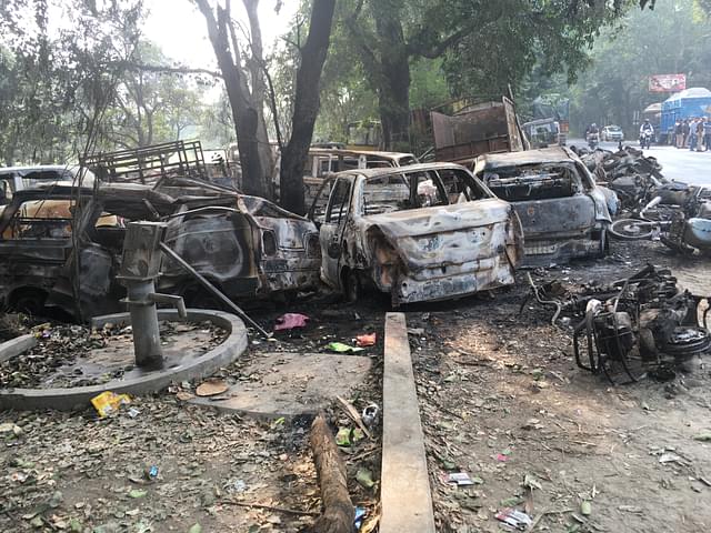 Charred vehicles outside Chingrawathi police booth