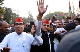 Samajwadi Party chief Akhilesh Yadav with senior party leader Kiranmoy Nanda in Lucknow. (Subhankar Chakraborty/Hindustan Times via GettyImages) 
