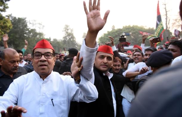 Samajwadi Party chief Akhilesh Yadav with senior party leader Kiranmoy Nanda in Lucknow. (Subhankar Chakraborty/Hindustan Times via GettyImages) 