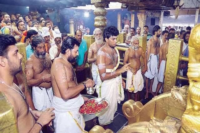 Tantric ritual by Tantri Kandararu Mahesh Mohanaru before opening the Shrine