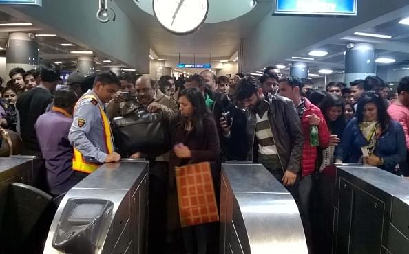 Long queues witnessed as people use public transport at Rajiv Chowk Metro Station. The DMRC issued the advisory in the view of the rush and high-security measures on the new year’s eve. (Sanchit Khanna/Hindustan Times via Getty Images)