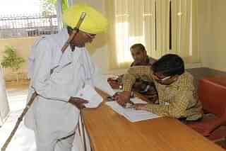 A Rajasthani voter exercises his ballot in the Lok Sabha Polls in 2014.