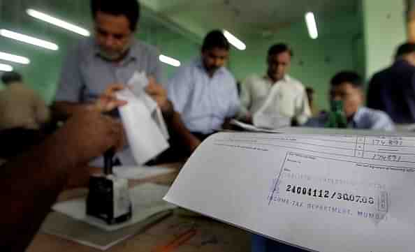 People queuing up at the Income Tax office in Mumbai to file their returns. (Satish Bate/Hindustan Times via Getty Images)