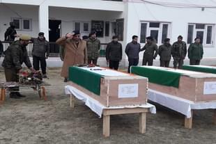 J&K police officers pay their final respects to the coffins of the martyred policemen.