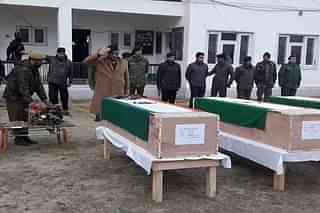 J&amp;K police officers pay their final respects to the coffins of the martyred policemen.