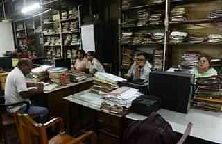 Employees at a government office in Kolkata. (DIBYANGSHU SARKAR/AFP/Getty Images)