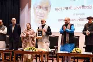 PM Modi releasing the commemorative Rs 100 coin in the memory of former prime minister Atal Bihari Vajpayee (Photo via Twitter)