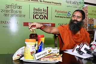 Baba Ramdev with Patanjali products (Arvind Yadav/Hindustan Times via Getty Images)