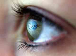 The Google logo is reflected in the eye of a girl. (Chris Jackson/Getty Images)&nbsp;