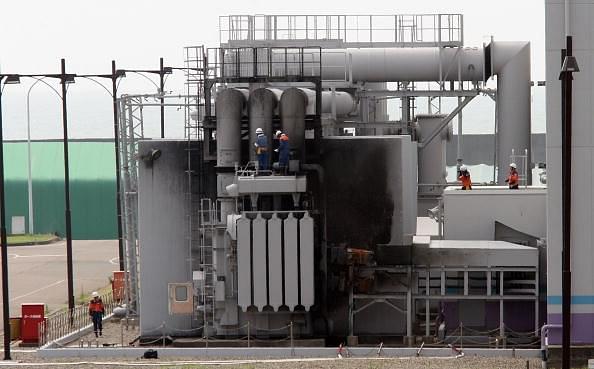 Japanese workers examining a nuclear power generation unit. (Koichi Kamoshida/Getty Images)
