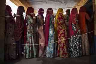 Representative image of Indian women waiting to vote at a polling station in Jodhpur, Rajasthan. (Kevin Frayer/Getty Images)