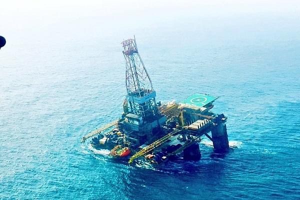 The tilted Olinda Star oil rig. (@indiannavy/Twitter)