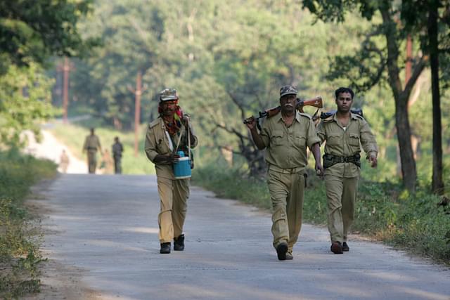 Police officers patrolling the naxal infested forests at Bijapur near Dantewada. (Sattish Bate/Hindustan Times via Getty Images)