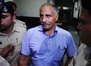 Arvind Joshi at a Bhopal court after surrendering in the disproportionate assets case (Mujeeb Faruqui/Hindustan Times via Getty Images)