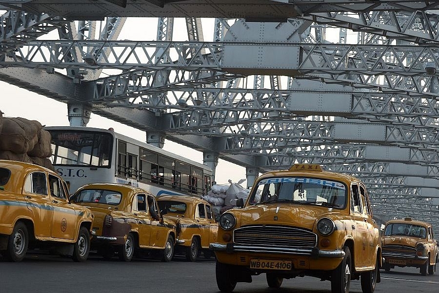 Indian commuters and taxi drivers navigate through heavy traffic on Howrah Bridge in Kolkata. (DIBYANGSHU SARKAR/AFP/Getty Images)