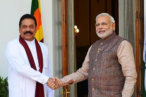 PM Modi (right) with Mahinda Rajapaksa (left) (Yasbant Negi/India Today Group/Getty Images)