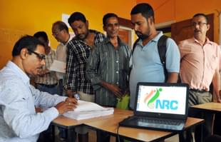 People check their name on the final draft list of the state’s NRC list at NRC Seva Kendra at Hatigaon on 30 July  2018 in Guwahati, India. (Rajib Jyoti Sarma/Hindustan Times via GettyImages) 