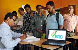  People check their name on the final draft list of the state’s NRC list at NRC Seva Kendra at Hatigaon on 30 July  2018 in Guwahati, India. (Rajib Jyoti Sarma/Hindustan Times via GettyImages)&nbsp;