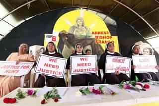  Nuns hold placards during a protest demanding justice after an alleged sexual assault of a nun by Bishop Mulakkal. (Vivek Nair/Hindustan Times via Getty Images)
