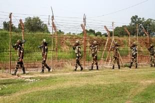 BSF soldiers patrolling the international border with Pakistan near Jammu. (Photo by Nitin Kanotra/Hindustan Times via Getty Images)