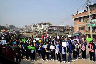Nepalese students hold placards at a protest rally in 2015