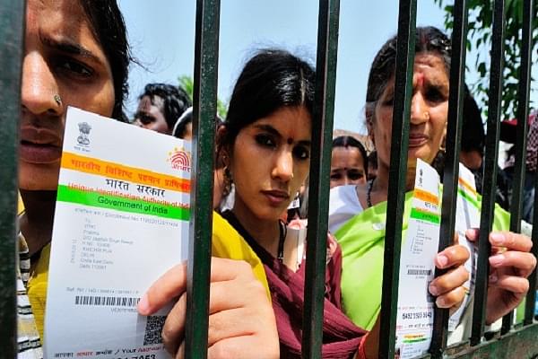 Women with their Aadhaar Cards at a government camp in New Delhi. (Photo by Priyanka Parashar/Mint via Getty Images)