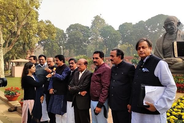 Shashi Tharoor and other Congress leaders protest outside the Parliament. (@ShashiTharoor/Twitter)