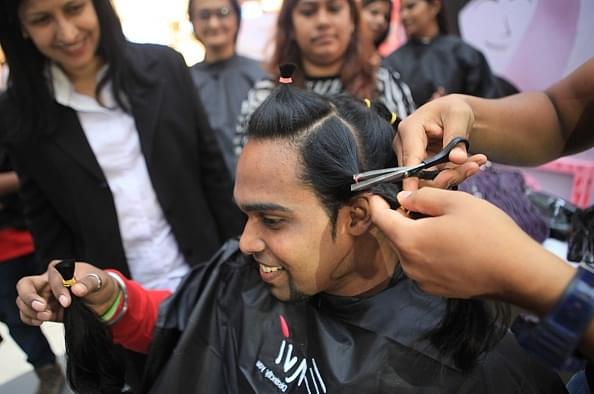 Representative image of a man getting a haircut in Mumbai. (Photo by Pratham Gokhale/Hindustan Times via Getty Images)