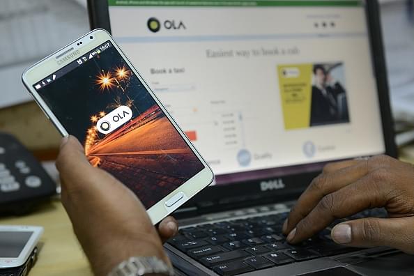 Representative image of the Ola app on a smartphone (Hemant Mishra/Mint via Getty Images)