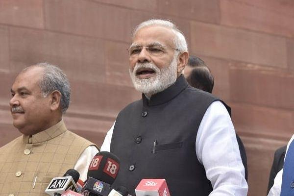 PM Modi with his Cabinet Ministers addresses the media after attending the first day of Parliament Winter Session. (Sonu Mehta/Hindustan Times via Getty Images)