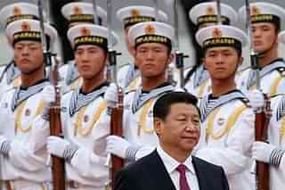 Chinese President Xi Jinping being presented a guard of honour by PLAN troops. (Photo by Feng Li/Getty Images)