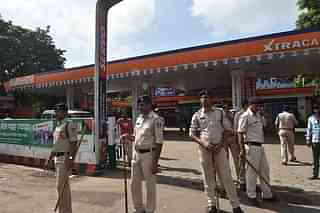 Policemen in Bhopal outside a petrol pump during a strike (Mujeeb Faruqui/Hindustan Times via Getty Images)