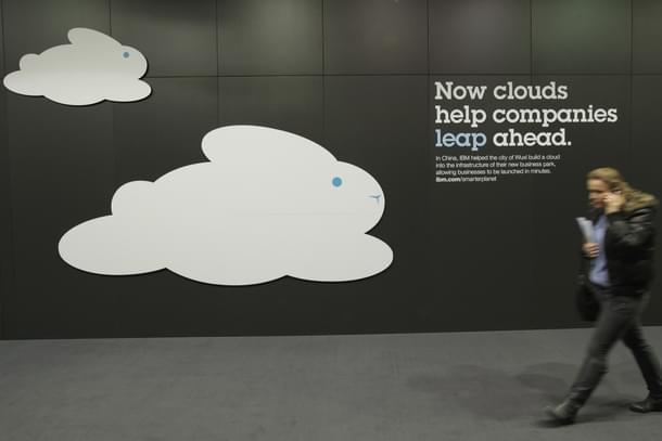 A woman walks past a could computing presentation at the IBM stand  in Hanover, Germany. (Sean Gallup/GettyImages) 