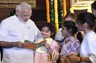 PM Modi with children in New Delhi. (Photo by Arvind Yadav/Hindustan Times via Getty Images)
