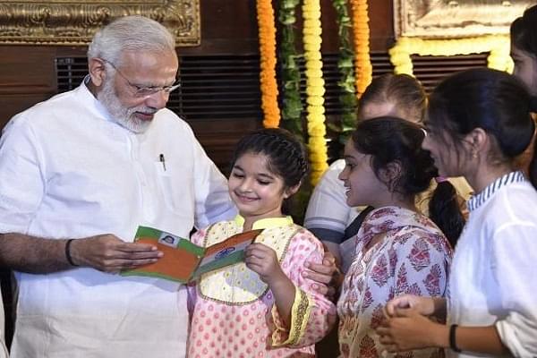 PM Modi with children. A Representative Image. (Photo by Arvind Yadav/Hindustan Times via Getty Images)
