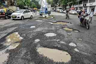 A road filled with pot holes (representative image) (Photo by Kunal Patil/Hindustan Times via Getty Images)