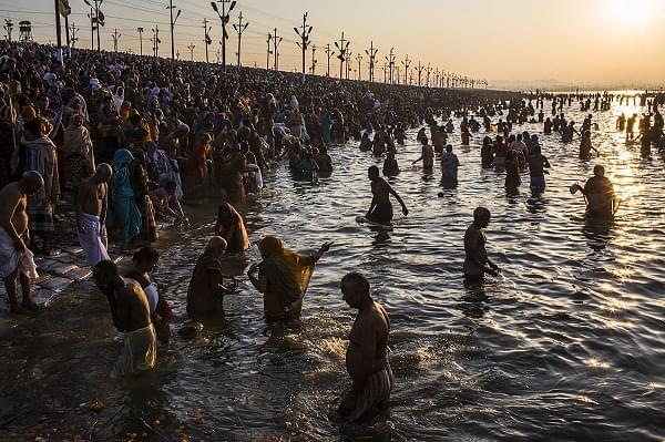 Devotees take a holy dip at the Kumbh  (Daniel Berehulak/Getty Images)