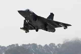 A Tejas flies during an ‘Initial Operational Clearance’ procedure. (Photo credit: STRDEL/AFP/GettyImages)