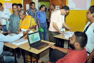 People check their name on the final draft list of Assam’s NRC list at NRC Seva Kendra at Hatigaon in Guwahati. (Rajib Jyoti Sarma/Hindustan Times via GettyImages)