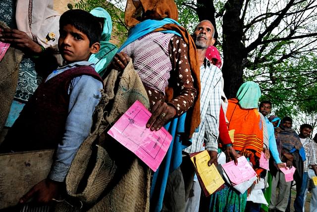 People waiting to get ration from Public Distribution System  outlet in village Khedla in Haryana, India. (Priyanka Parashar/Mint via Getty Images)&nbsp;