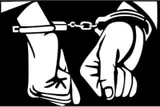 An artistic representation of a person in handcuffs (Vectoportal via Wikimedia Commons)