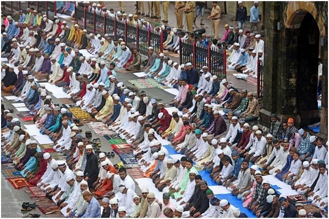 Muslim devotees offer prayers on the occasion of Eid al-Adha outside Bandra Station, (Satyabrata Tripathy/Hindustan Times via Getty Images)