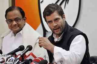 Congress president Rahul Gandhi with party leader P Chidambaram during a press conference in New Delhi. (Sanjeev Verma/Hindustan Times via GettyImages)