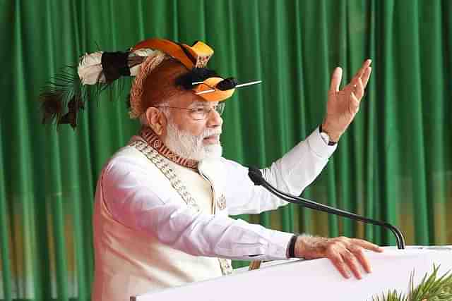 PM Narendra Modi in Nyishi tribal headgear of Arunachal Pradesh during his visit to Itanagar (Source:  <a href="https://twitter.com/saagar_anand">@<b>saagar_anand</b></a>/Twitter)