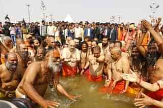 BJP President Amit Shah Taking Holy Dip Along With UP CM Yogi Adityanath (Photo: BJP Website)